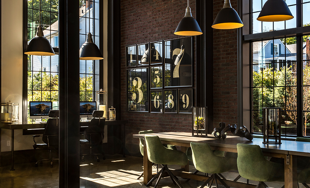 Business center with multiple workspace options looking out on greenery at Halstead Salem Station
