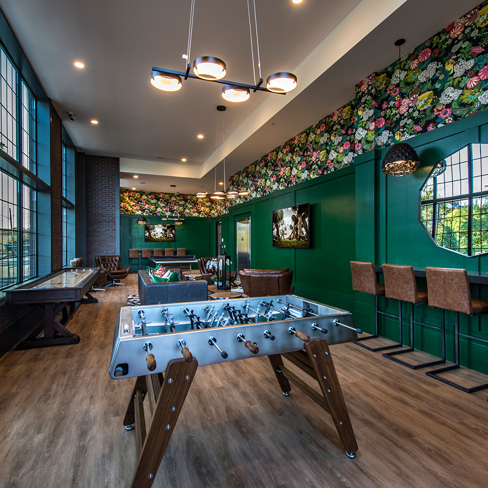 Residents' club with foosball and shuffleboard at Halstead Salem Station