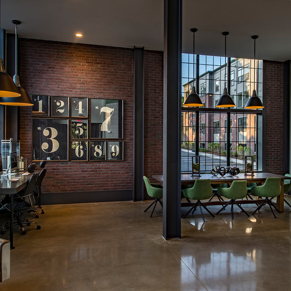 Business center with conference table at Halstead Salem Station luxury apartment complex
