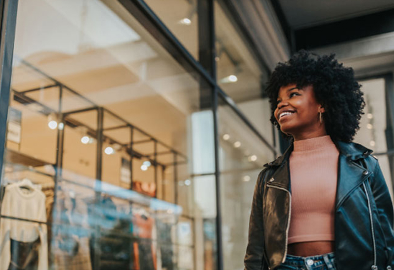 A woman window shops in Salem